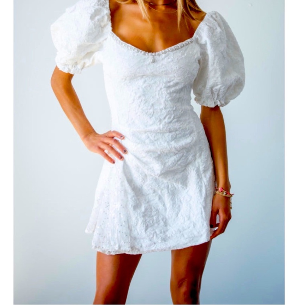 Never worn in original packaging, The Donelli Dress, white, size Medium.